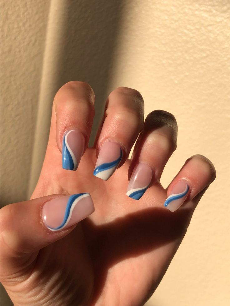 Trendy Nail Design: Soft Pink and Vibrant Blue with Elegant Curves