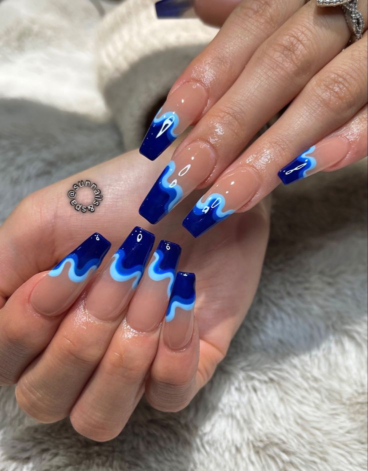 Dynamic Deep Blue and Light Turquoise Nail Design with Glossy Finish.