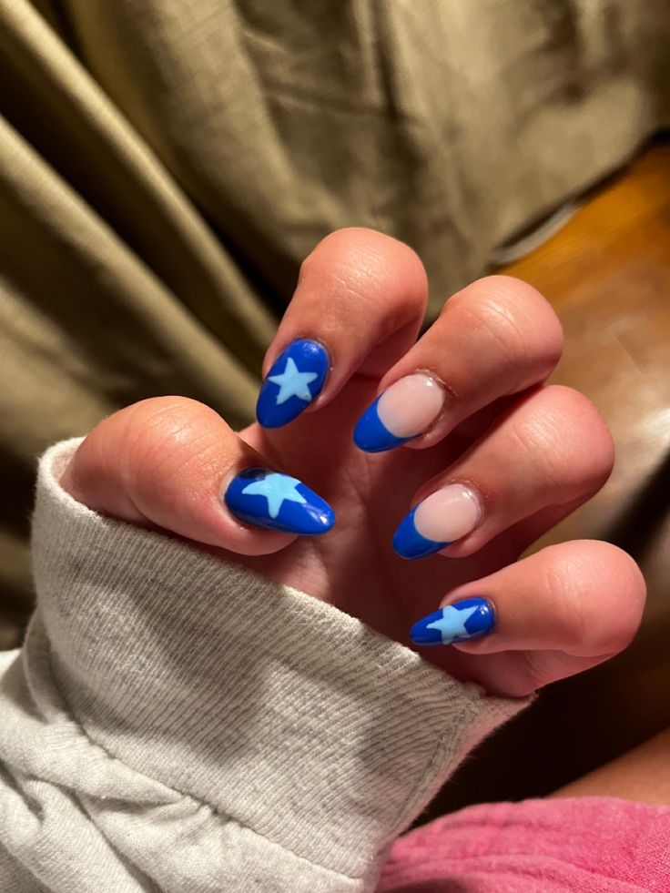 Playful Blue Star Nail Design: A Trendy and Creative Statement.