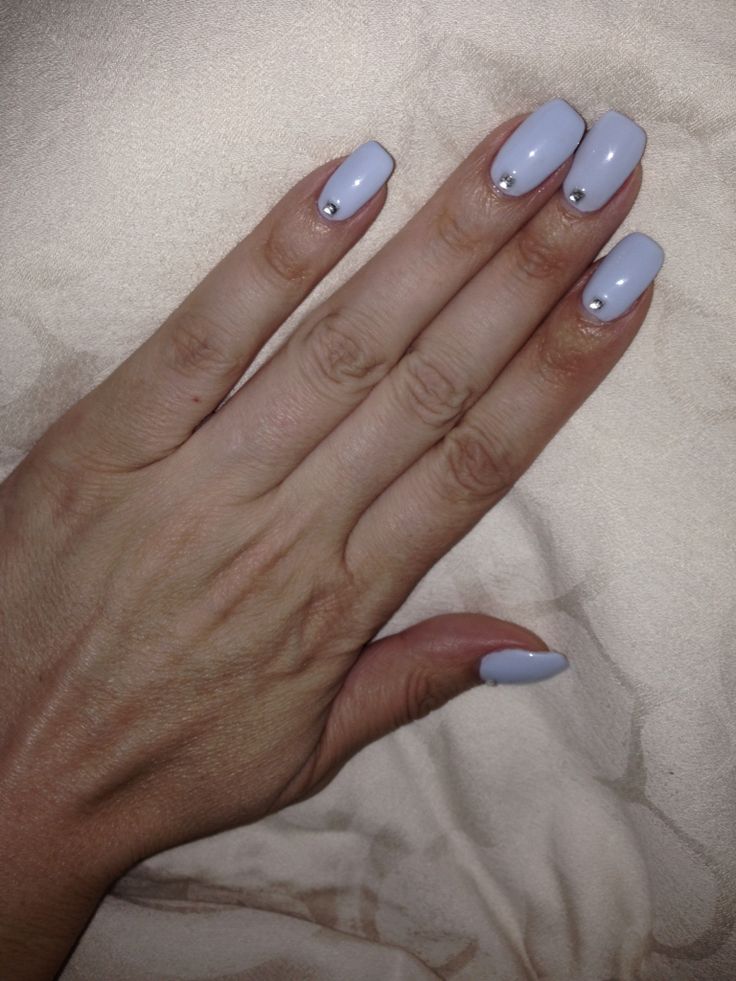 Chic Lavender Pastel Nails with Glossy Finish and Subtle Metallic Accents.