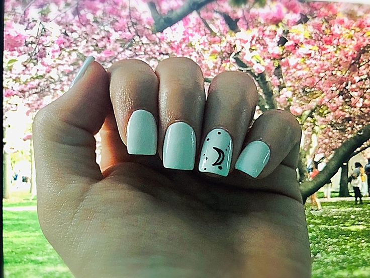 Pastel Elegance: Whimsical Nail Design with Glossy Finish for Spring.