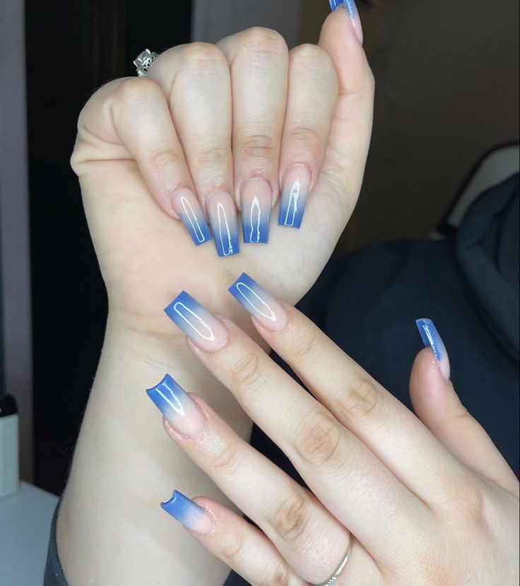 Stunning Ombre Nail Design with Gradient Blue Hues and Modern Elegance.