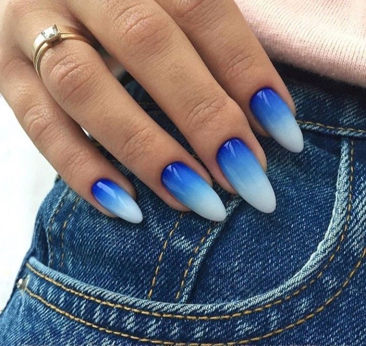 Elegant Ombre Blue Nail Design with Almond Shape and Chic Jewelry Accents