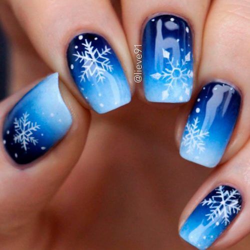 Frosty Winter Ombre Nail Design with Blue Gradient and Snowflake Accents