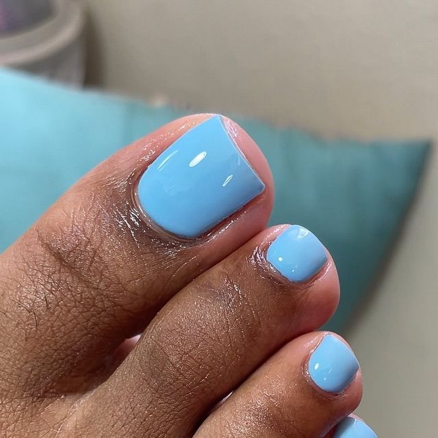 Refreshing Soft Blue Pedicure: A Versatile Summer Finish for All Skin Tones.