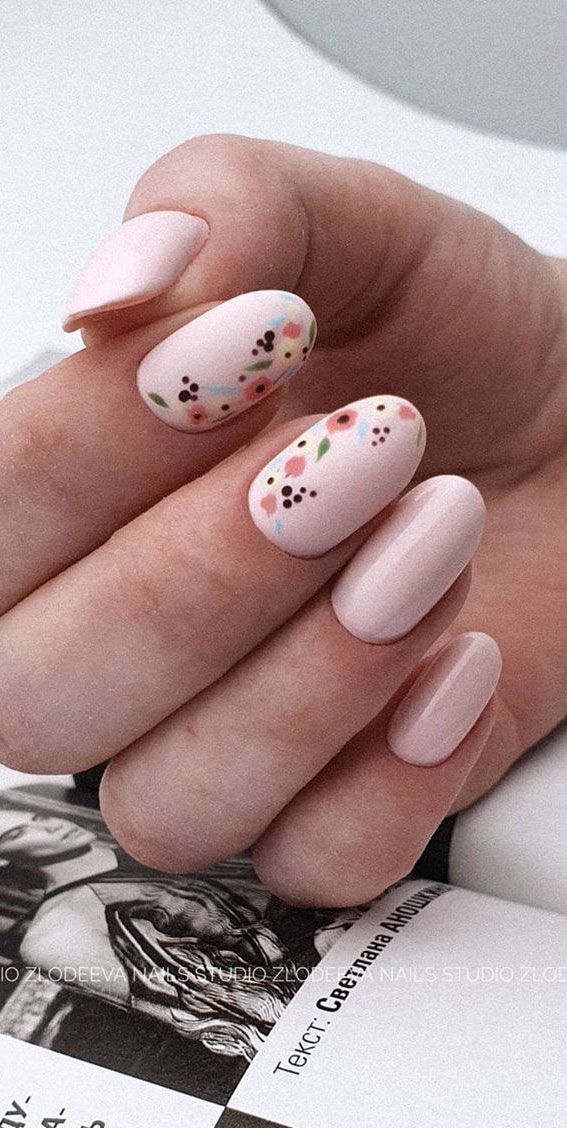 Charming Floral Accented Pink Nails for Versatile Spring and Summer Style.