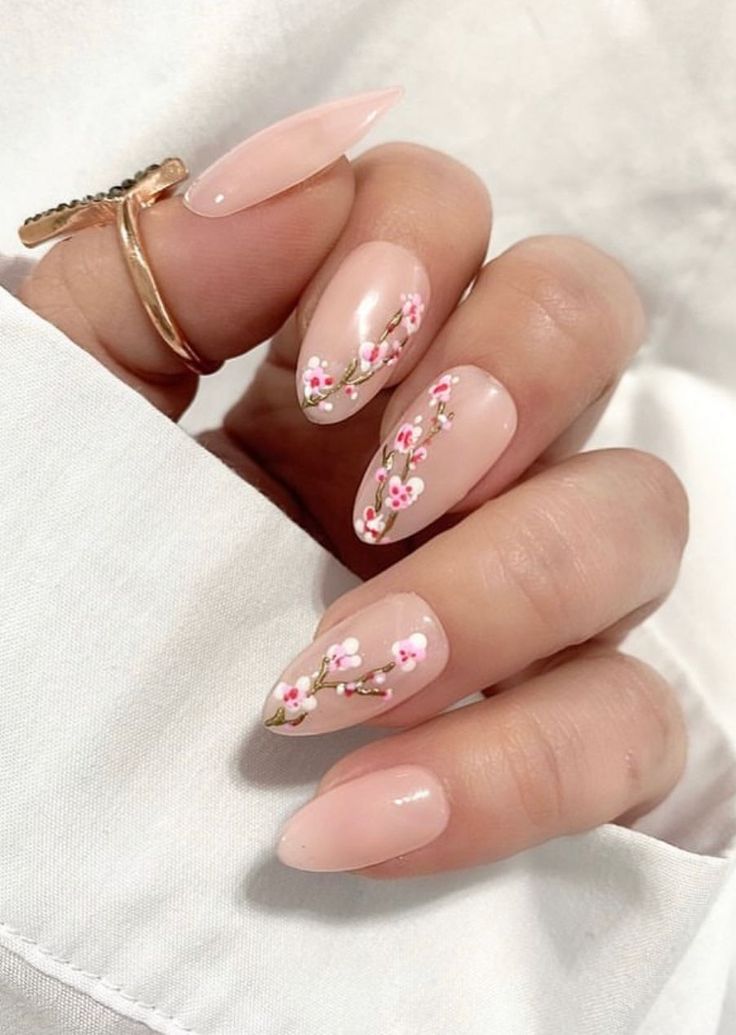 Elegant Floral Nail Design: Soft Pink Blossoms on Nude with Hand-Painted Vines