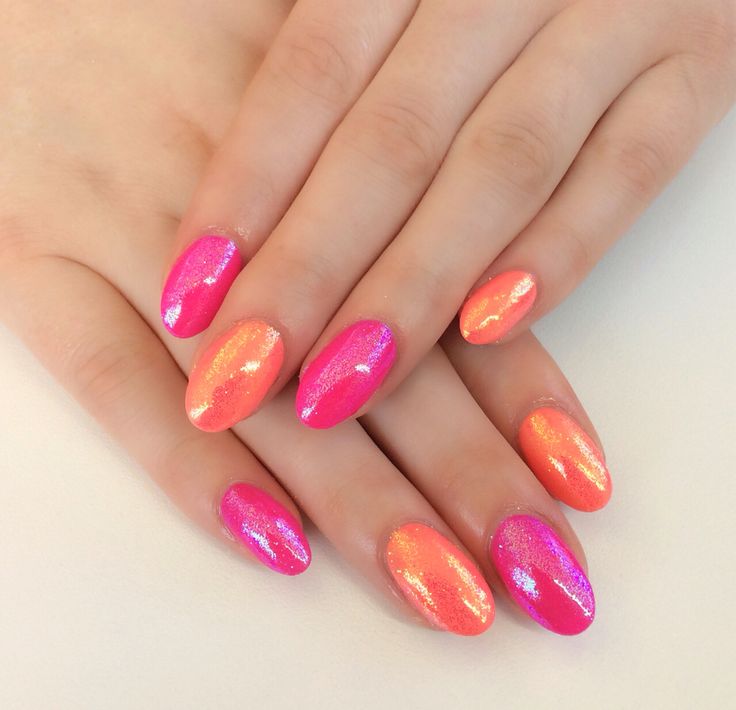 Chic Gradient Nail Design in Pink and Coral with Shimmering Finish.