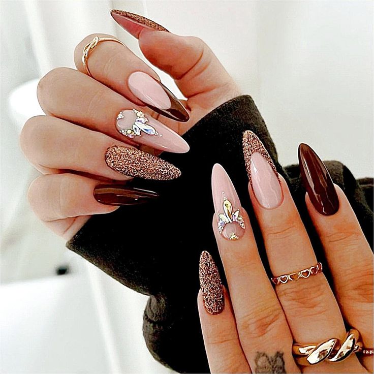 Chic Nail Design: Sophisticated Soft Pinks, Rich Browns, and Glittering Gold Accents for Special Occasions.