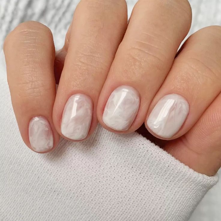 Elegant Marble Nail Design with Soft White and Pastel Swirls