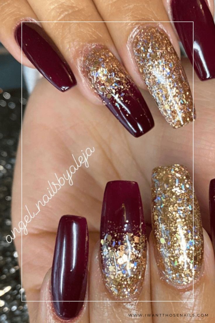 Glamorous Burgundy Nails with Shimmering Gold Accents for a Sophisticated Look.