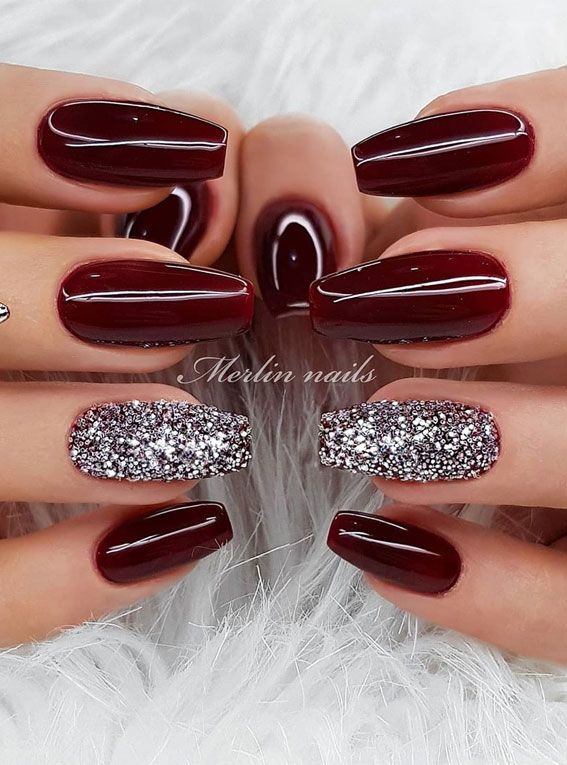 Elegant Deep Burgundy Nail Design with Sparkling Silver Accents for Glamorous Occasions.