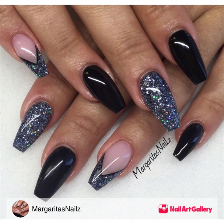 Chic Matte Black and Shimmering Nail Design with Glittery Accents and Sophisticated Color Blend.