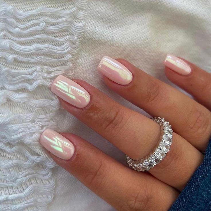 Elegant Glossy Pale Pink Nails with Iridescent Sheen and Sophisticated Square Shape, Perfect for Any Occasion.