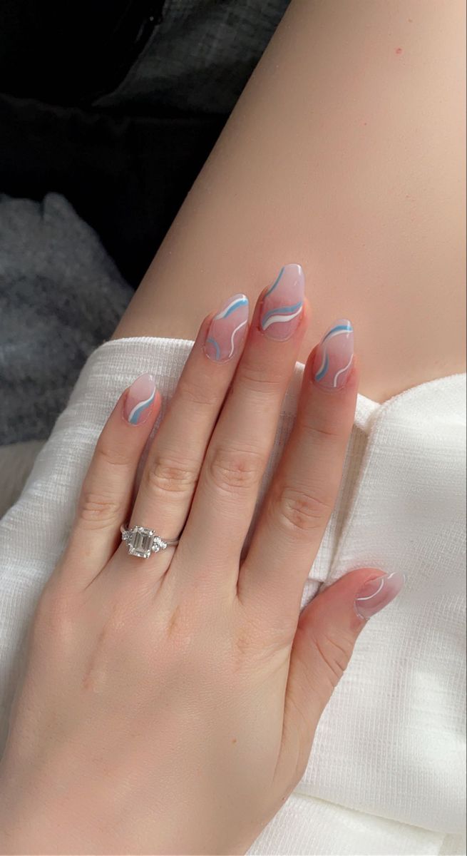 Elegant Ombre Nail Design with Pastel Swirls and Wave Patterns