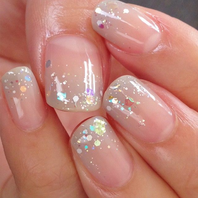 Chic Iridescent Glitter on Elegant Nude Nails: A Modern, Timeless Look