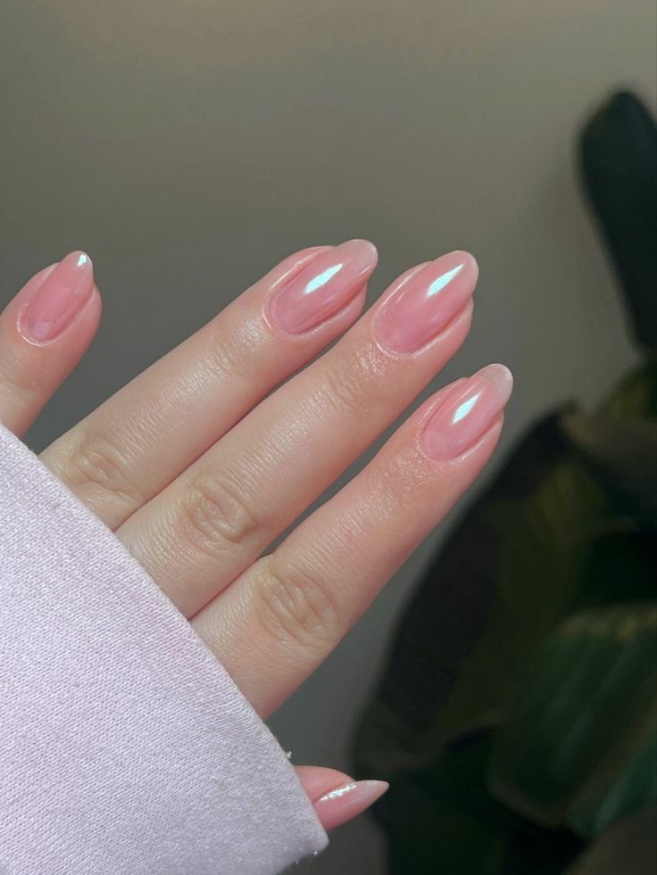 Chic Almond-Shaped Manicure: Soft Pink Base with Iridescent Tips for Modern Elegance.