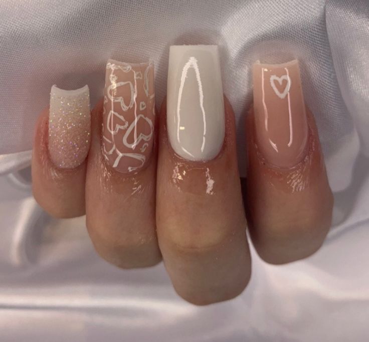 Elegant Chic Nail Design: Glossy White, Subtle Nude, and Sparkling Accents.