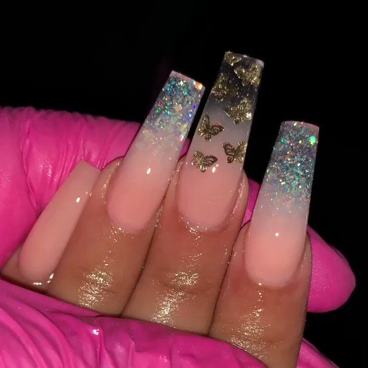 Elegant Ombre Nails with Glitter Tips and Gold Butterfly Accents