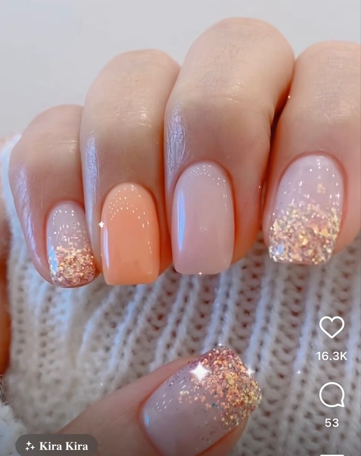 Chic Nude and Peach Gradient Nail Design with Glitter Accents.