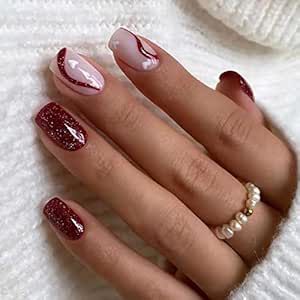 Chic Burgundy Nail Design with Sparkling Accents and Swirls of Pink and White.