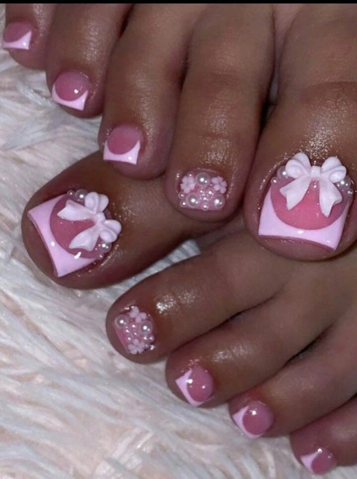 Whimsical Elegant Pedicure Design with Soft Pink and Glossy White Accents.