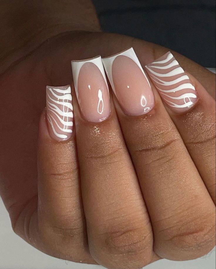 Chic Nude and White Nail Design: Elegant Shapes and Playful Stripes.