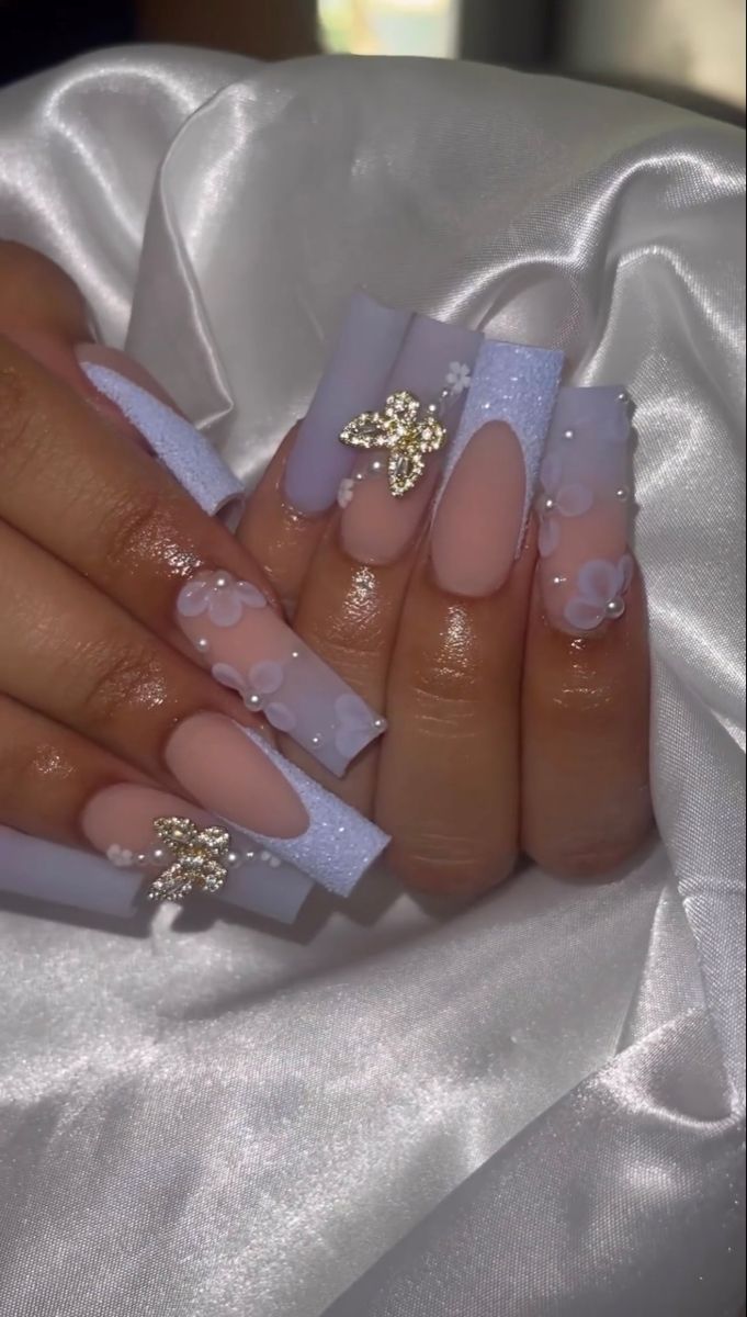 Elegant Pastel Floral Nail Design with 3D Embellishments.