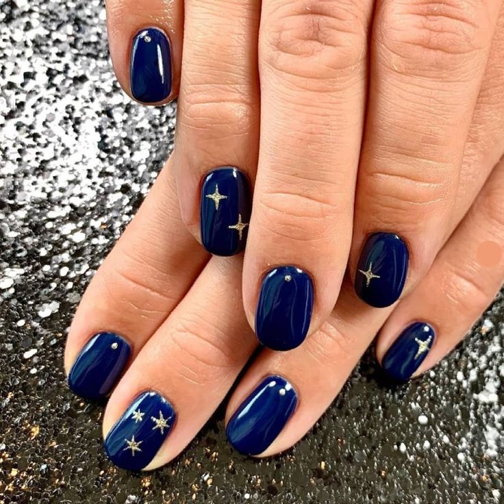 Celestial-Inspired Navy Blue Nails with Gold Stars and Rhinestones