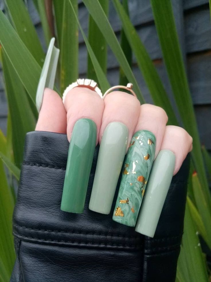 Chic Green Nail Design with Luxurious Gold Accents and Glossy-Matte Finish.