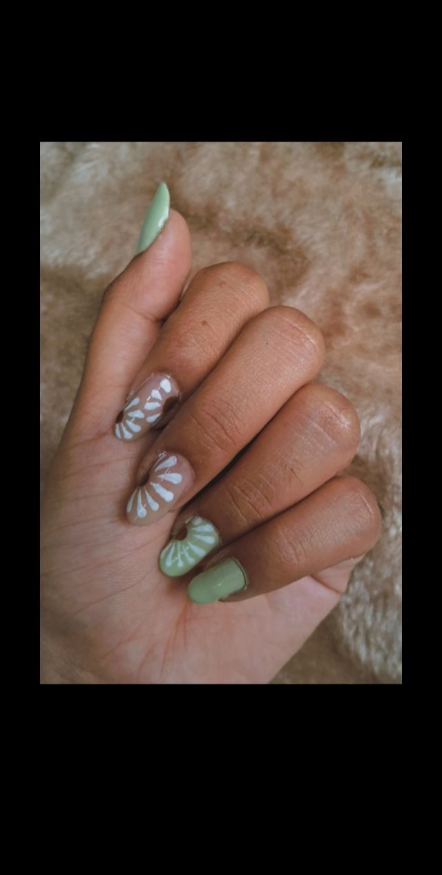 Elegant Nail Design with Muted Green and White, Featuring Artistic Floral Patterns and Glossy-Matte Finish.