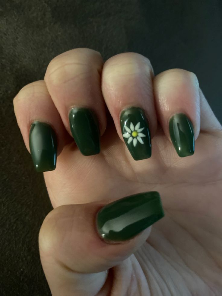 Elegant Dark Green Nail Design with Glossy Floral Accents