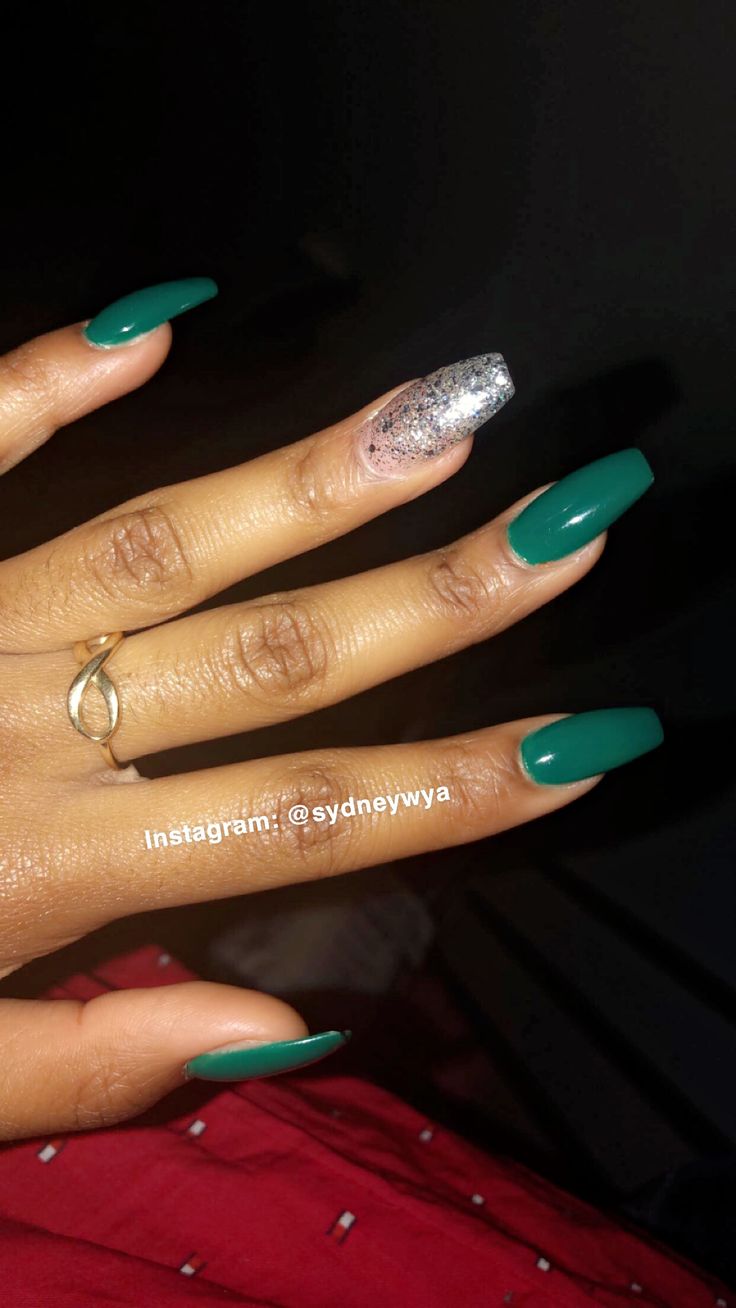 Sophisticated Elegance: Green Nails with Glamorous Silver Accents