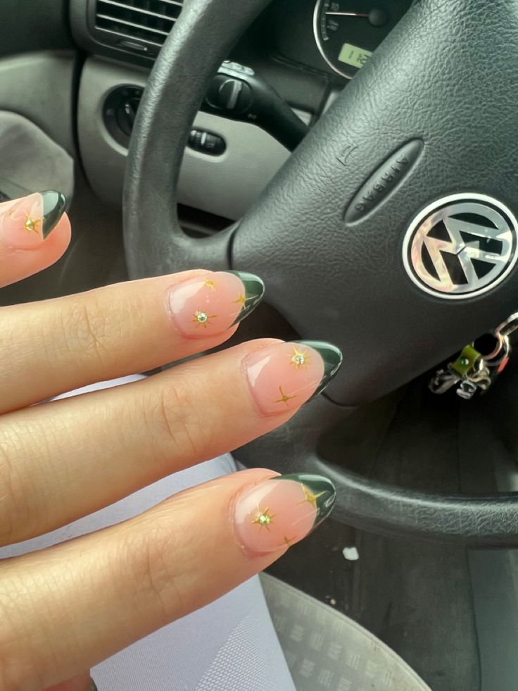 Elegant Nail Design: Natural Base with Green French Tips and Charming Floral Accents