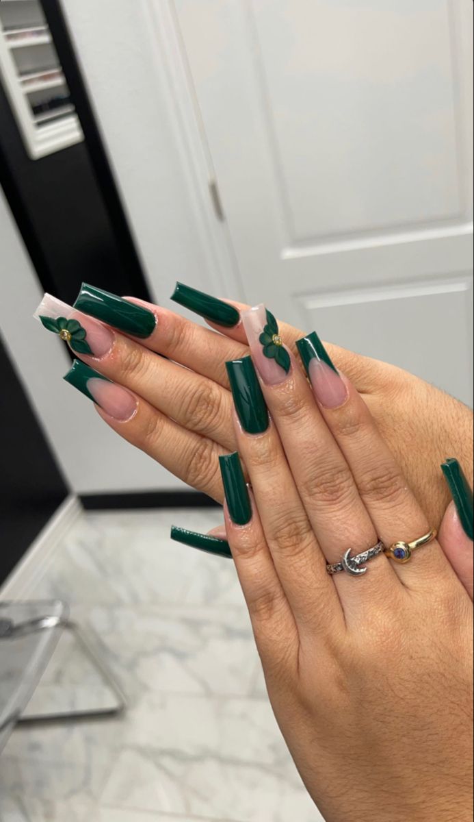 Sophisticated Elegant Green Nail Design with Glossy Emerald, Clear Tips, and Floral Embellishments.