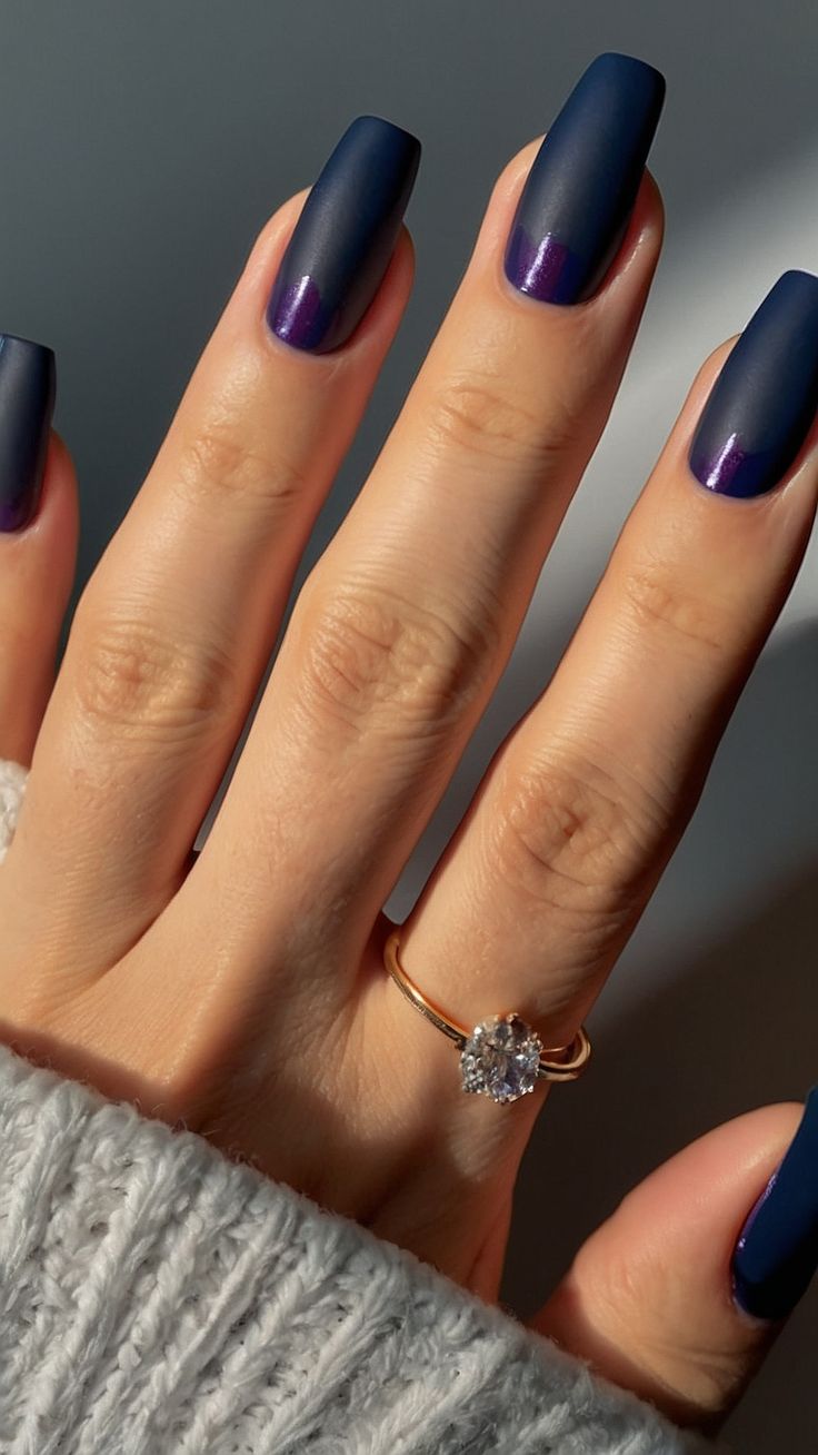 Sophisticated Matte Nail Design in Dark Blue and Purple With Elegant Accents.