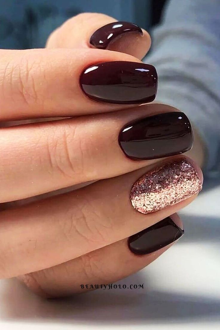 Chic Deep Burgundy Nail Design with Sparkling Rose Gold Accent.