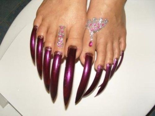 Elegant Deep Purple Long Nails with Sparkling Gemstone Art for Bold Statements.