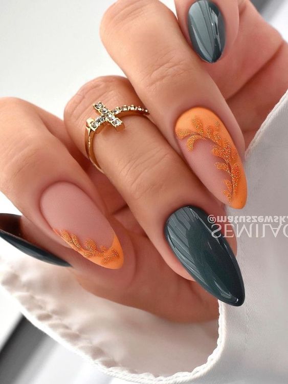 Elegant and Eye-Catching Nail Design: Matte Peach and Glossy Dark Green with Intricate Orange Florals.