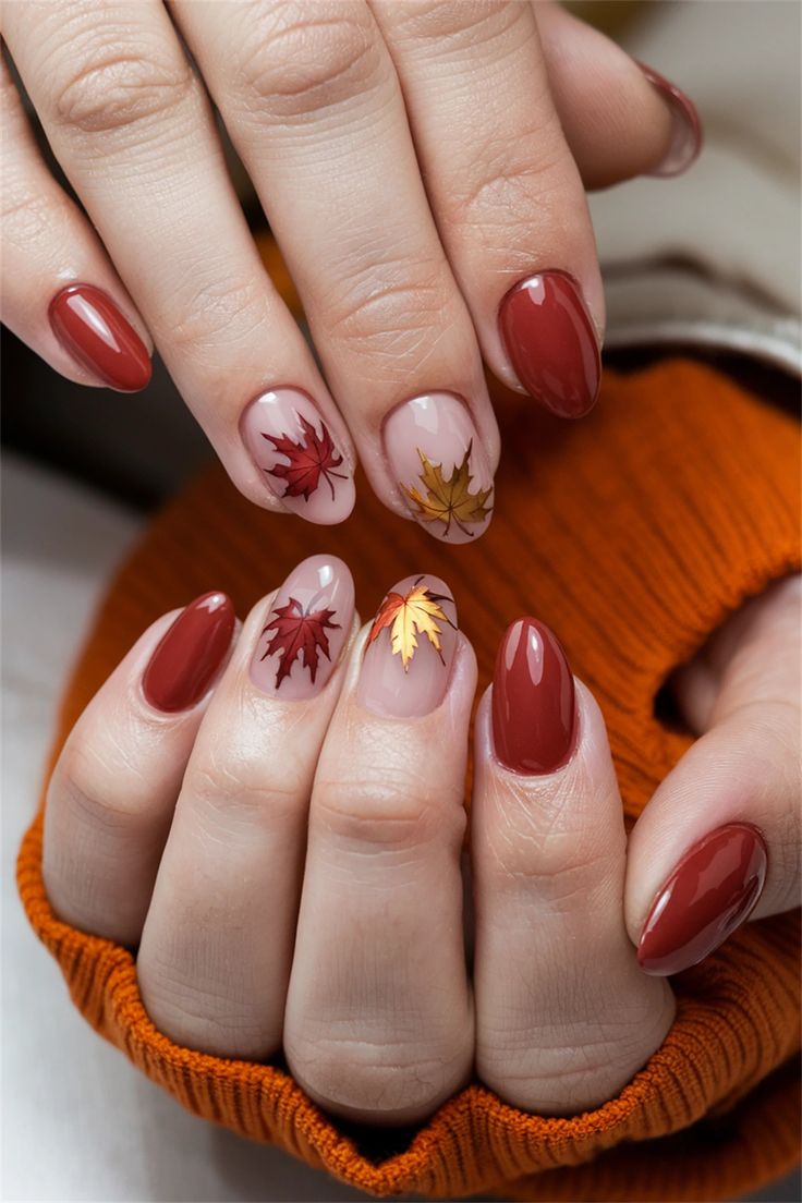 Autumn-Inspired Nail Design: Cozy Warm Colors and Intricate Leaf Patterns.