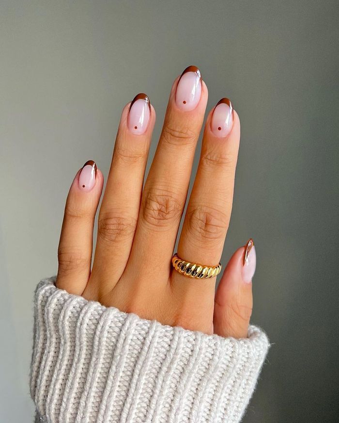 Chic Soft Pink and Brown French Tip Nail Design with Elegant Details.