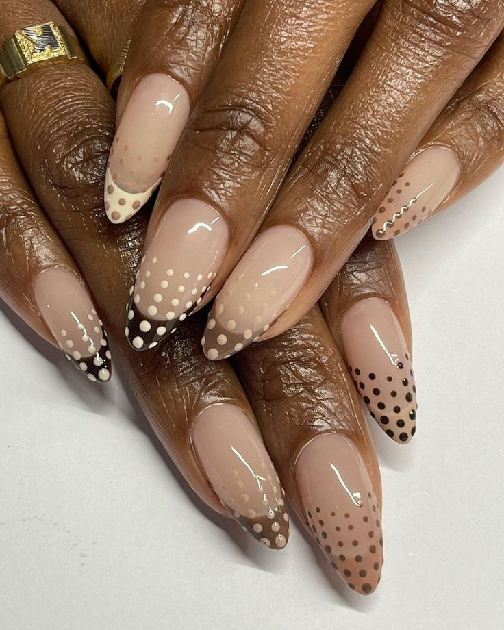 Sophisticated Nude Base Nail Design with Polka Dot Gradient and Chic Black-and-White Tips.