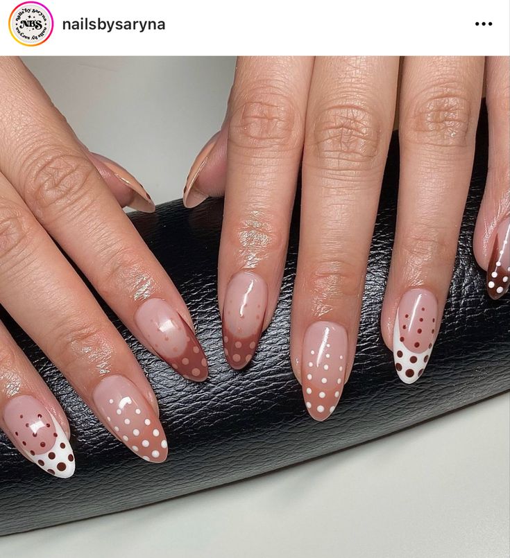 Elegant Nude Nail Design with Intricate Polka Dots and White Tips.