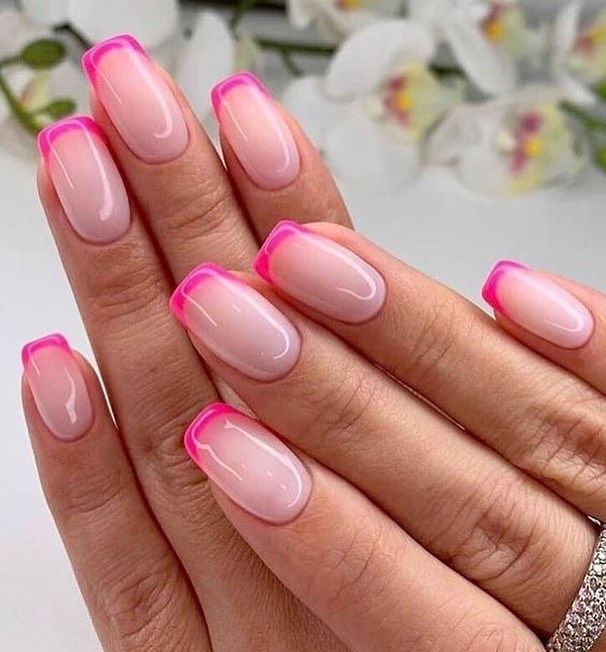 Chic Pink-Tipped Nails: A Playful Twist on Classic French Manicure.