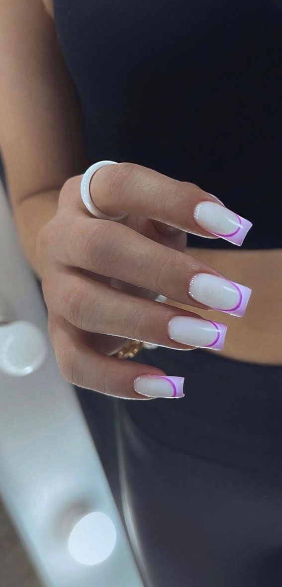 Chic Nail Design: Sleek White Base with Playful Pink Tip Gradient.