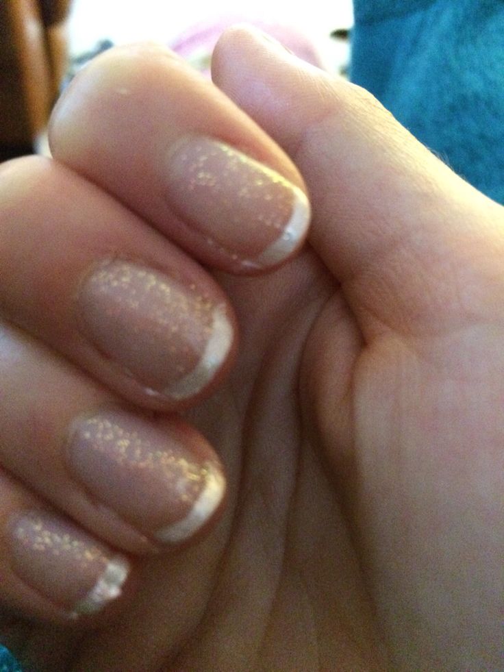 Timeless Elegant Nail Design with Subtle Glitter and Classic French Tips