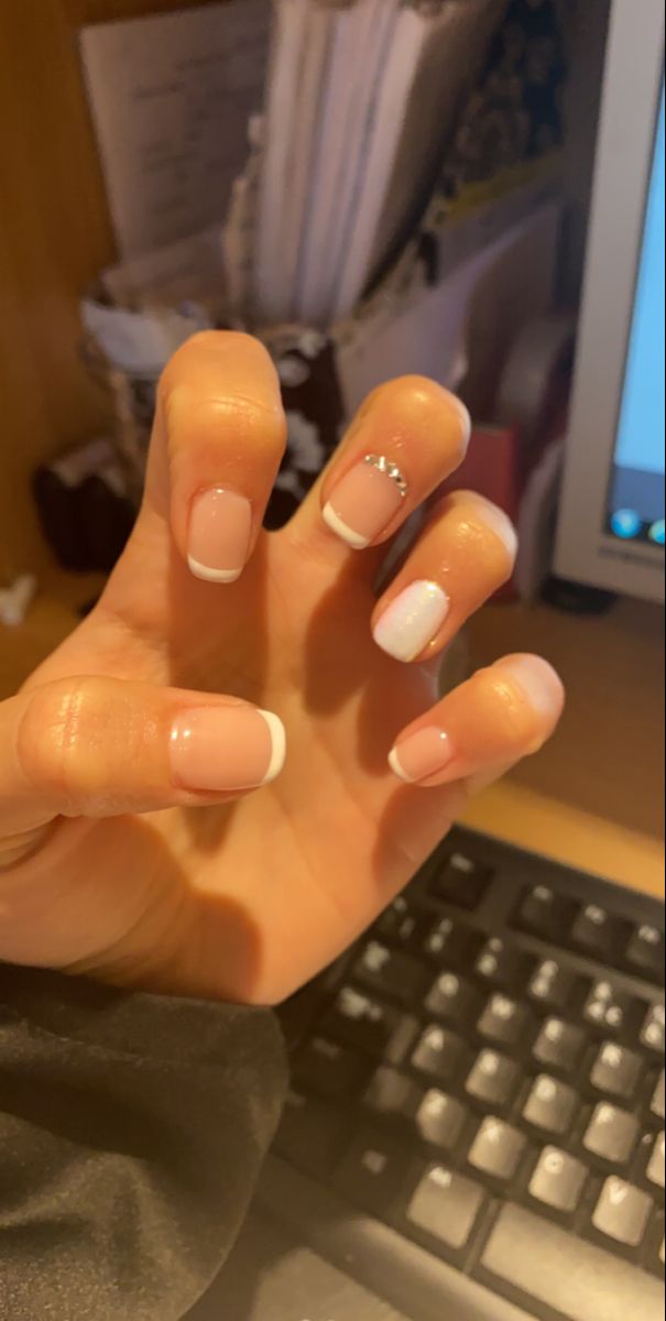 Elegant French Tip Manicure with Soft Pink Base and Silver Accent for Timeless Versatility.