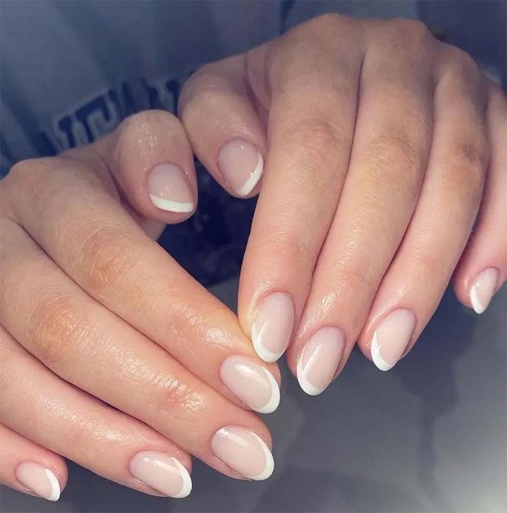 Sophisticated Almond-Shaped French Manicure: Soft Nude Base with Crisp White Tips.