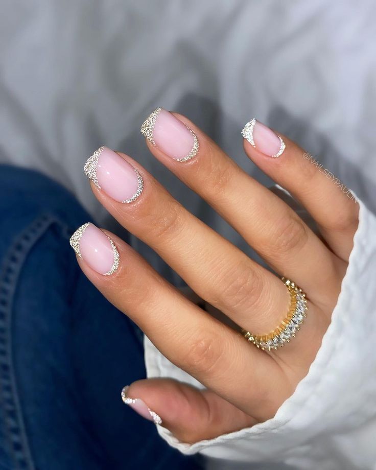 Elegant Soft Pink and Shimmering Silver French Manicure for All Occasions.