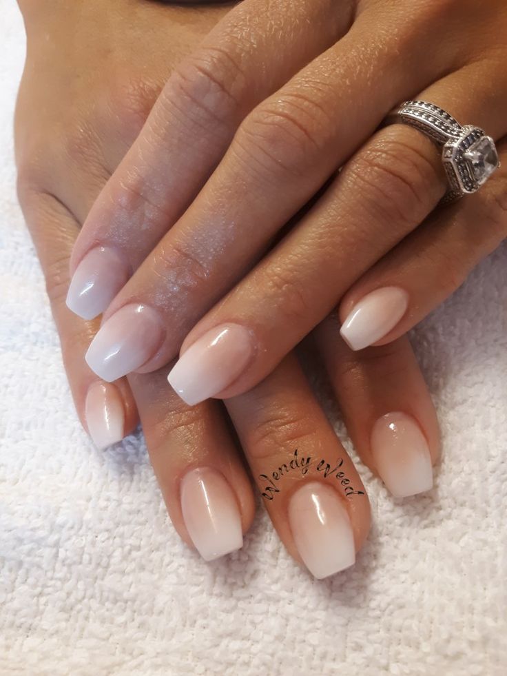 Sophisticated Ombre Nails: Natural Pink to Subtle White with Sparkling Ring Accent